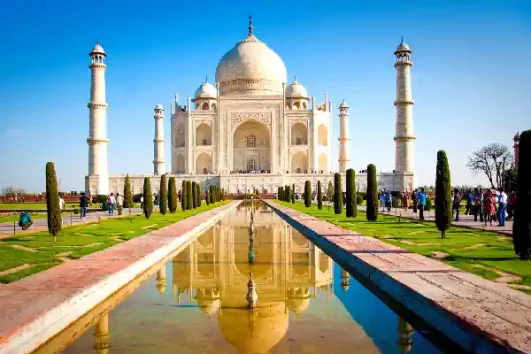 Taj Mahal reflecting in water during a guided Agra tour from Delhi
